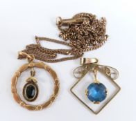 A 14ct gold pendant (1.1g) on a 9ct gold chain and another 9ct gold pendant (2.4g)