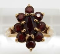 A 9ct gold ring set with garnets, 3.3g, size M