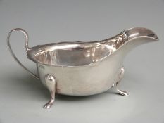 George V hallmarked silver sauce boat raised on three pad feet, Sheffield 1933 maker's Viners Ltd,