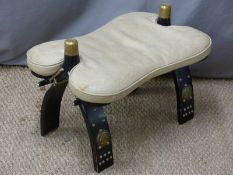 An upholstered carved camel stool, W40 x D57cm