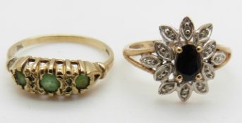 A 9ct gold ring set with a sapphire and diamonds and a 9ct gold ring set with emeralds, 4g,