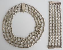A white metal necklace and matching bracelet made up of cylinder links in a net pattern, 282g