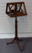 19thC mahogany double sided or duet music stand with lyre decoration, with articulated candle