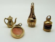 An 18ct gold pendant set with a cameo, and three 9ct gold charms, 3.5g