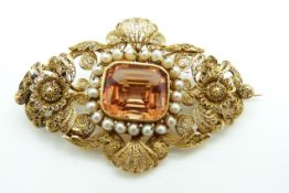 Victorian filigree brooch set with a mixed cushion cut imperial topaz surrounded by pearls, 10.5g,
