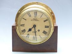 Brass bulkhead/marine clock with Dent, 28 Cockspur Street, London, 62677 to Roman dial, the spring