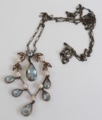 WITHDRAWN Victorian gold pendant set with six pear cut aquamarine drops, a single round cut