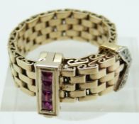 Art Deco buckle ring made up of rectangular links set with four square step cut rubies and five