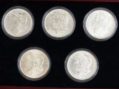 Five Decade Set of Uncirculated Morgan Silver USA dollars, in deluxe case