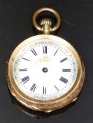 An 18ct gold pocket watch with black Roman numerals, floral decorated white enamel dial, engraved