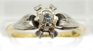 An 18ct gold ring set with a diamond in a platinum setting, 2.7g, size K