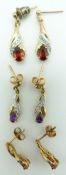 A pair of 9ct gold earrings set with a ruby and diamonds to each, an amethyst pair and a garnet pair