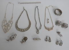 A collection of paste/diamanté jewellery including necklace, brooches and earrings