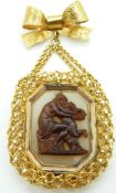 Victorian filigree and bow brooch set with chalcedony and a carved scene of a women and cherub, 3.