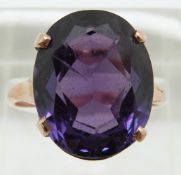 A 14ct gold ring set with a large synthetic colour change sapphire, 4.9g, size P