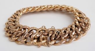 A French 18ct gold bracelet made up of textured links, 33g