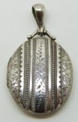 Victorian silver locket with raised decoration