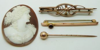Two 9ct gold brooches, a Victorian stick pin and a cameo, 4g