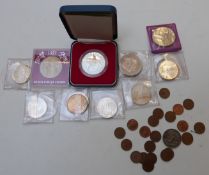 A small collection of commemorative coins etc including seven silver 1972 Munich Olympic examples,