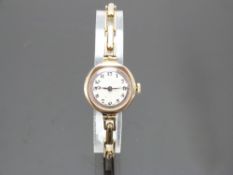 Rotary 9ct gold ladies wristwatch with blued Breguet hands, black Arabic numerals, two-tone silver