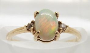 A 9ct gold ring set with an opal and diamonds, 1.3g, size J
