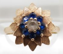 A 9ct gold ring set with paste in a textured setting, 2.4g, size L