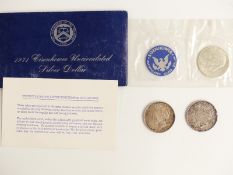 Three USA silver dollars comprising 1922 and 1924 Liberty examples and a 1971 uncirculated