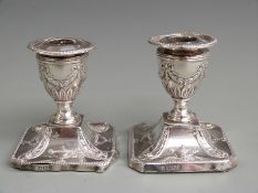 Pair of Victorian hallmarked silver squat candlesticks with neoclassical decoration, Sheffield