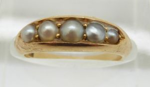Victorian 18ct gold ring set with five graduated pearls, 4.7g