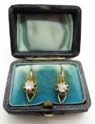A pair of Victorian earrings each set with an old cut diamonds of approximately 0.3ct, in original