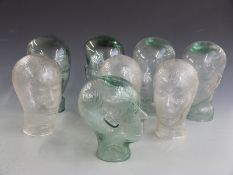 Eight shop display or similar glass heads