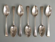 Seven Georgian hallmarked silver Old English pattern dessert spoons, length 17cm, five being