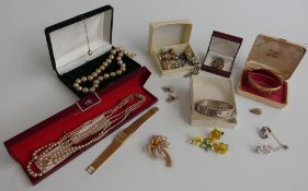 A silver locket, cufflinks, silver bangle, yellow metal pendant set with a scarab beetle,