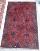Afghan red ground rug, 207 x 130cm