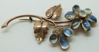 Victorian rose gold brooch set with moonstone cabochons in the form of a flower, 7 x 4cm