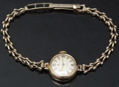 Cyma Cymaflex 9ct gold ladies wristwatch with gold hands and hour markers, silver dial and signed 17