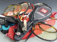 Collection of Wilson tennis racquets, most modern carbon/graphite