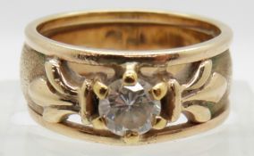 A 9ct gold ring set with a 0.45ct round cut diamond, 7.4g, size L