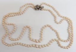 A double strand of cultured pearls with silver clasp