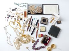 A large collection of costume jewellery including lorgnette, watches, necklaces, amber necklace,