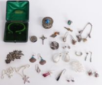 A collection of silver jewellery including earrings, Art Deco silver ring, brooches, charm bracelet,