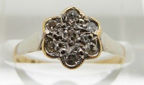 An 18ct gold ring set with diamonds in a flower cluster, 2g, size K