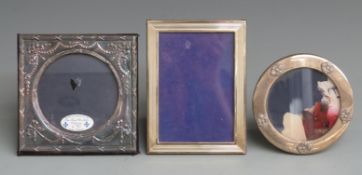 Three various modern hallmarked silver photograph frames, one being rectangular to suit 5x3.5 inch
