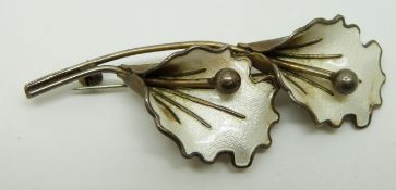 Norwegian silver brooch set with white enamel in the form of two flowers, length 7cm