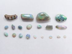 Three opal cabochons and a moonstone cabochon
