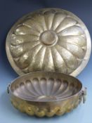 Two large and four twin handled brass lobed bowls with engraved decoration, by repute used on the