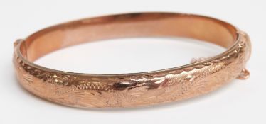 A 9ct rose gold bangle, 10.5g (5.8 x 5.2cm)