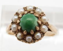 A 9ct gold ring set with turquoise cabochon surrounded by pearls, 3.4g, size Q
