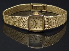 Roamer 18ct gold ladies wristwatch with black hands, gold baton markers, gold dial and signed 19