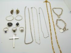 Two silver bracelets, a Monet necklace, two silver necklaces, a silver cross, three silver rings etc